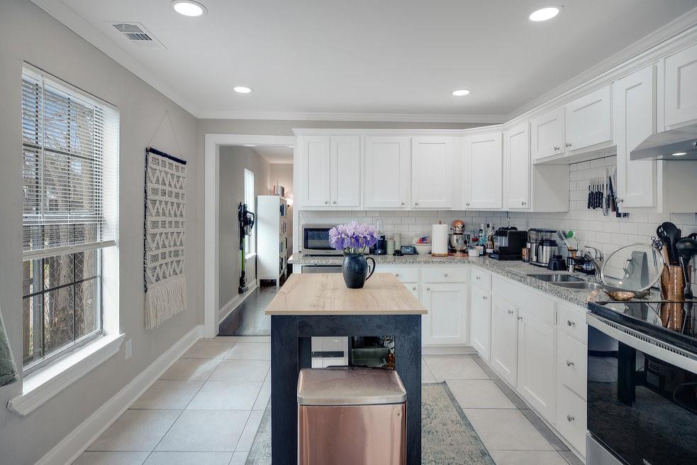 4029 Knox Street Fort Worth, TX 76119 - Photo 6 of 28 a kitchen with a refrigerator sink and cabinets
