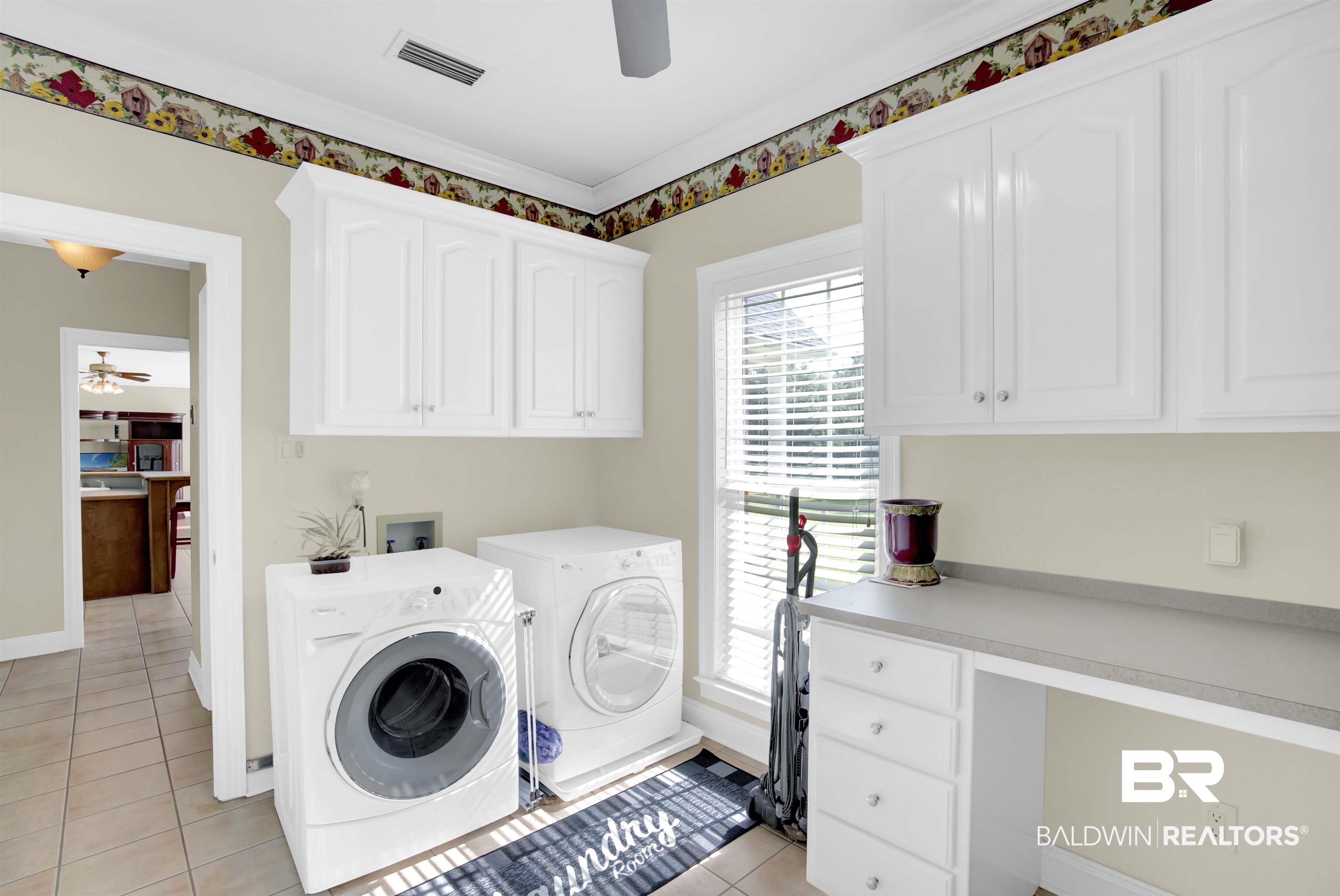 27688 Rigsby Road Daphne, AL 36526 - Photo 25 of 56 Clothes washing area featuring cabinets, light tile patterned floors, ceiling fan, and washer and dryer