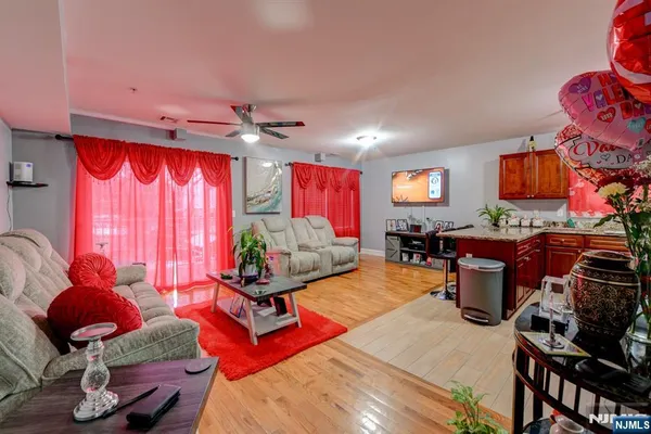 a living room with furniture a rug and a window
