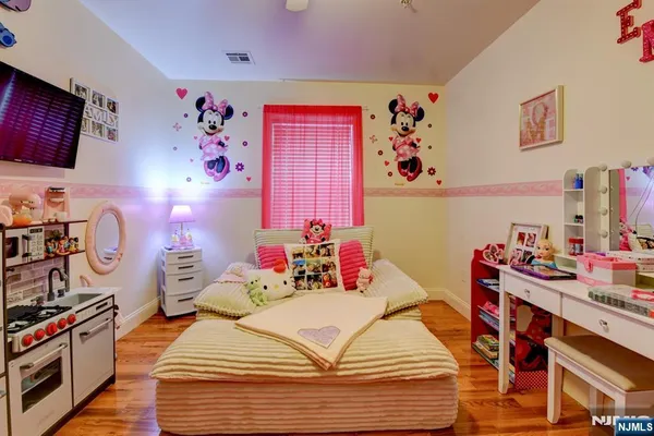 a bedroom with a bed and dresser