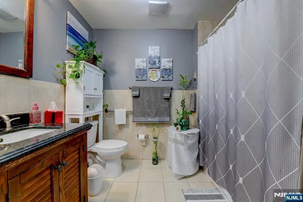 a kitchen with a sink and a potted plant