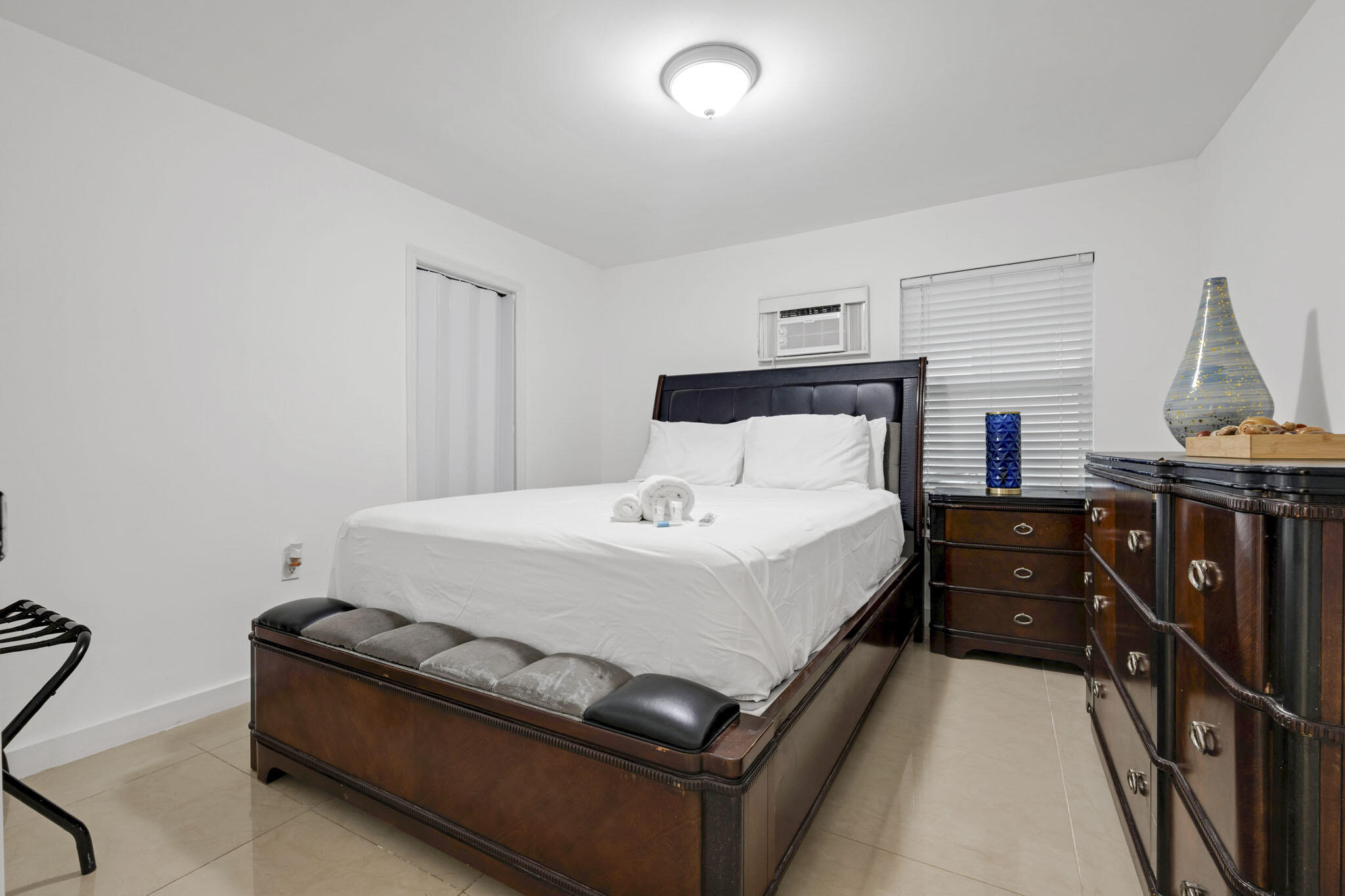 2365 Northwest 68th Street Miami, FL 33147 - Photo 13 of 22 a bedroom with a bed and wooden floor