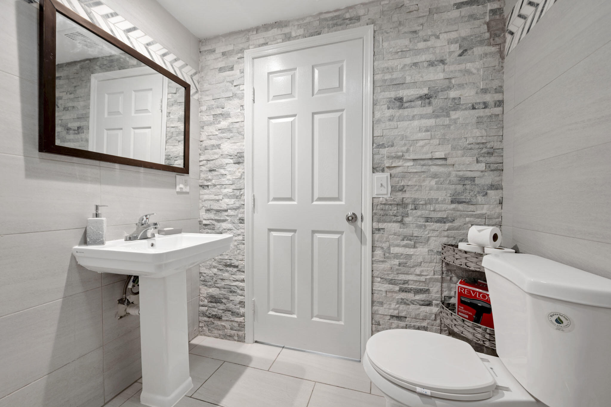 2365 Northwest 68th Street Miami, FL 33147 - Photo 14 of 22 a bathroom with a sink a toilet and shower