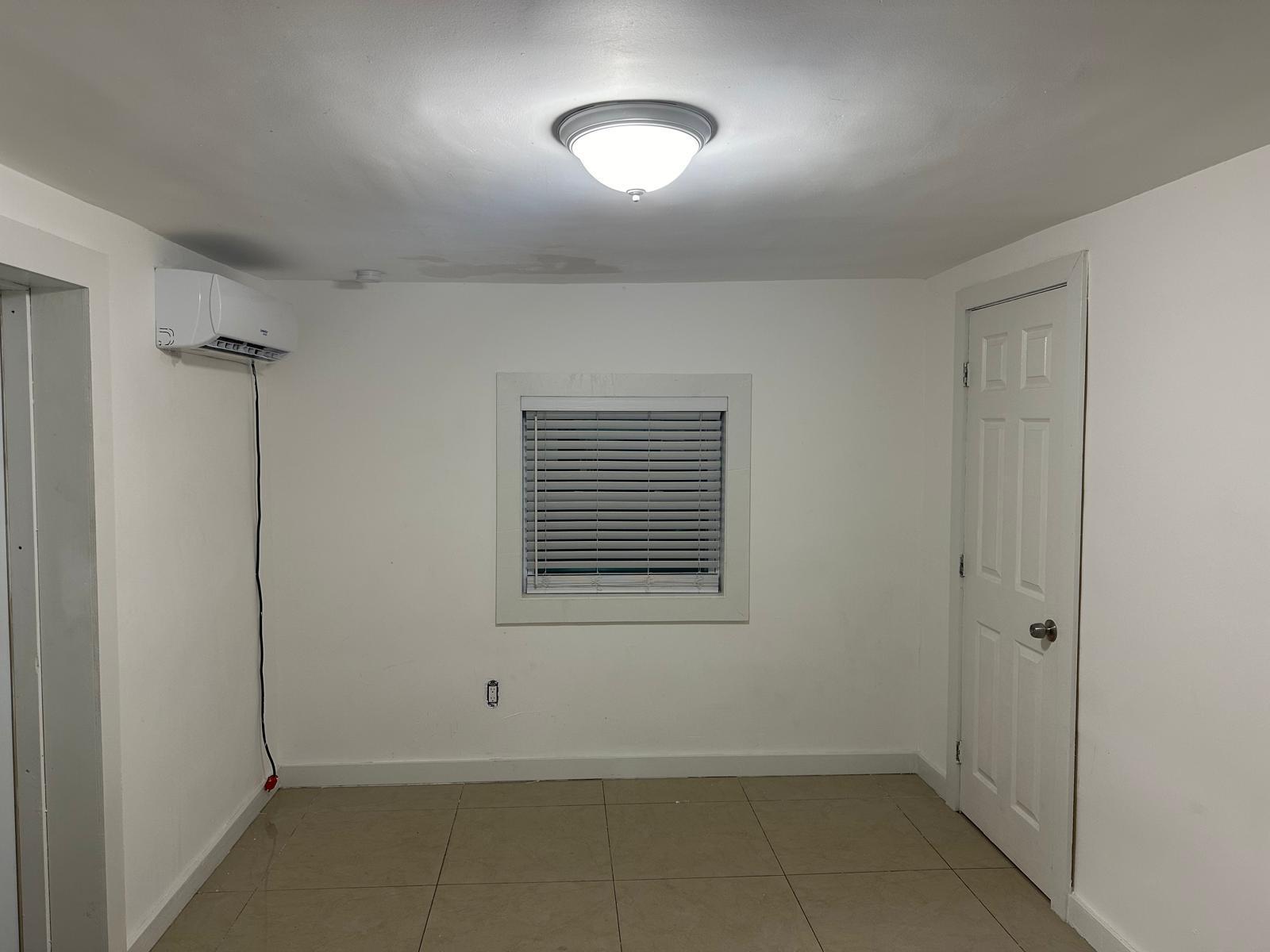 2365 Northwest 68th Street Miami, FL 33147 - Photo 18 of 22 a view of an empty room