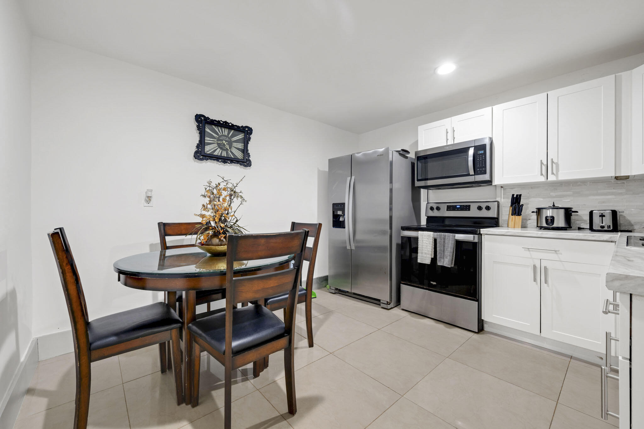 2365 Northwest 68th Street Miami, FL 33147 - Photo 9 of 22 a view of a dining room with furniture