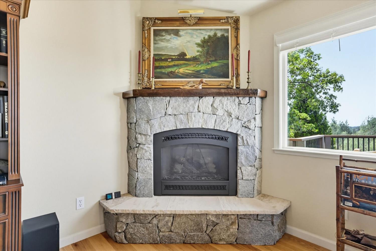 970 Morgan Ranch Drive Grass Valley, CA 95945 - Photo 8 of 76 a living room with a fireplace and a window
