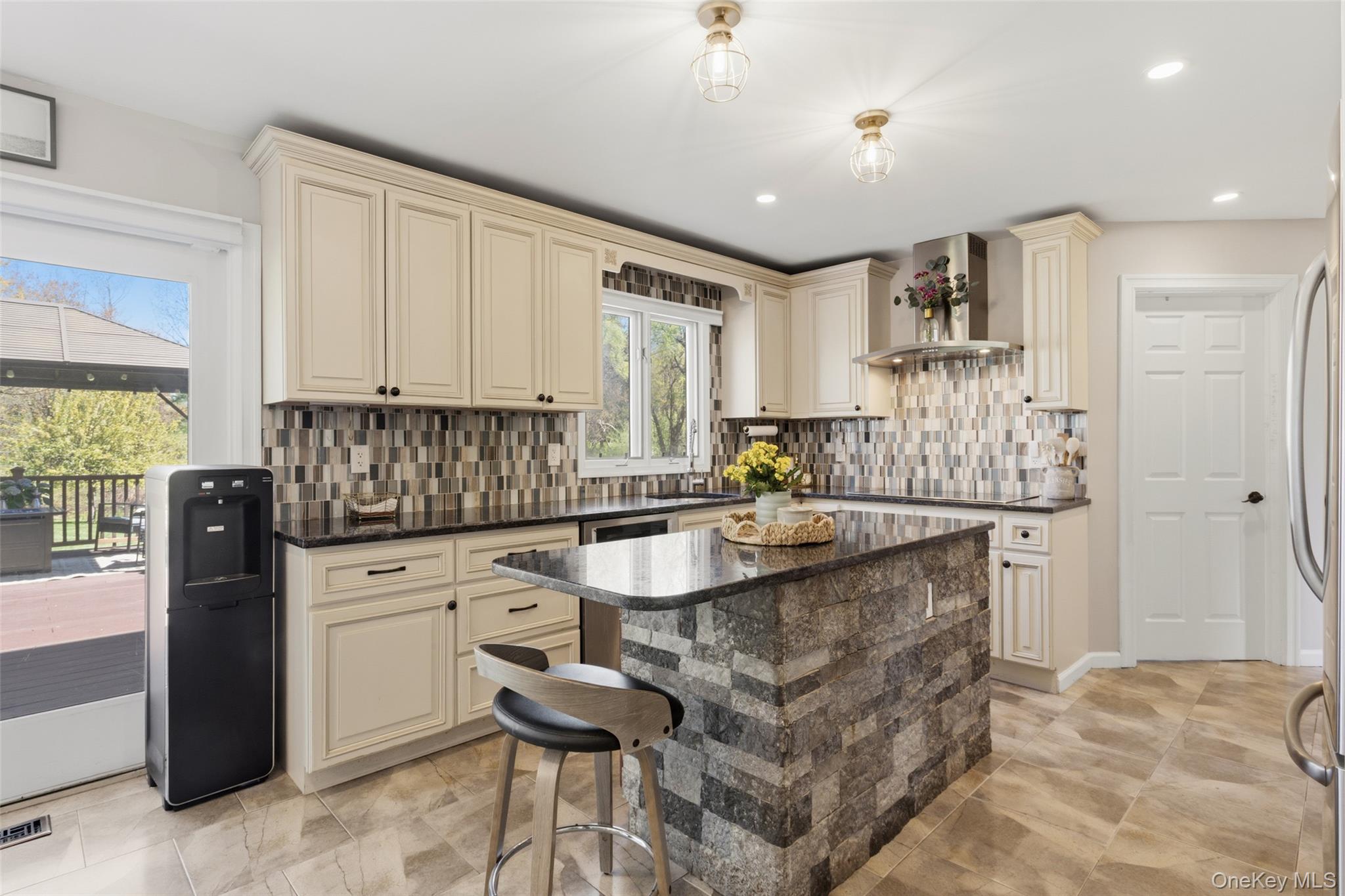 130 Cobb Road Brewster, NY 10509 - Photo 13 of 48 The heart of the home is the well-appointed kitchen, featuring granite countertops, stainless steel appliances, a double wall oven, electric cooktop, and tile flooring