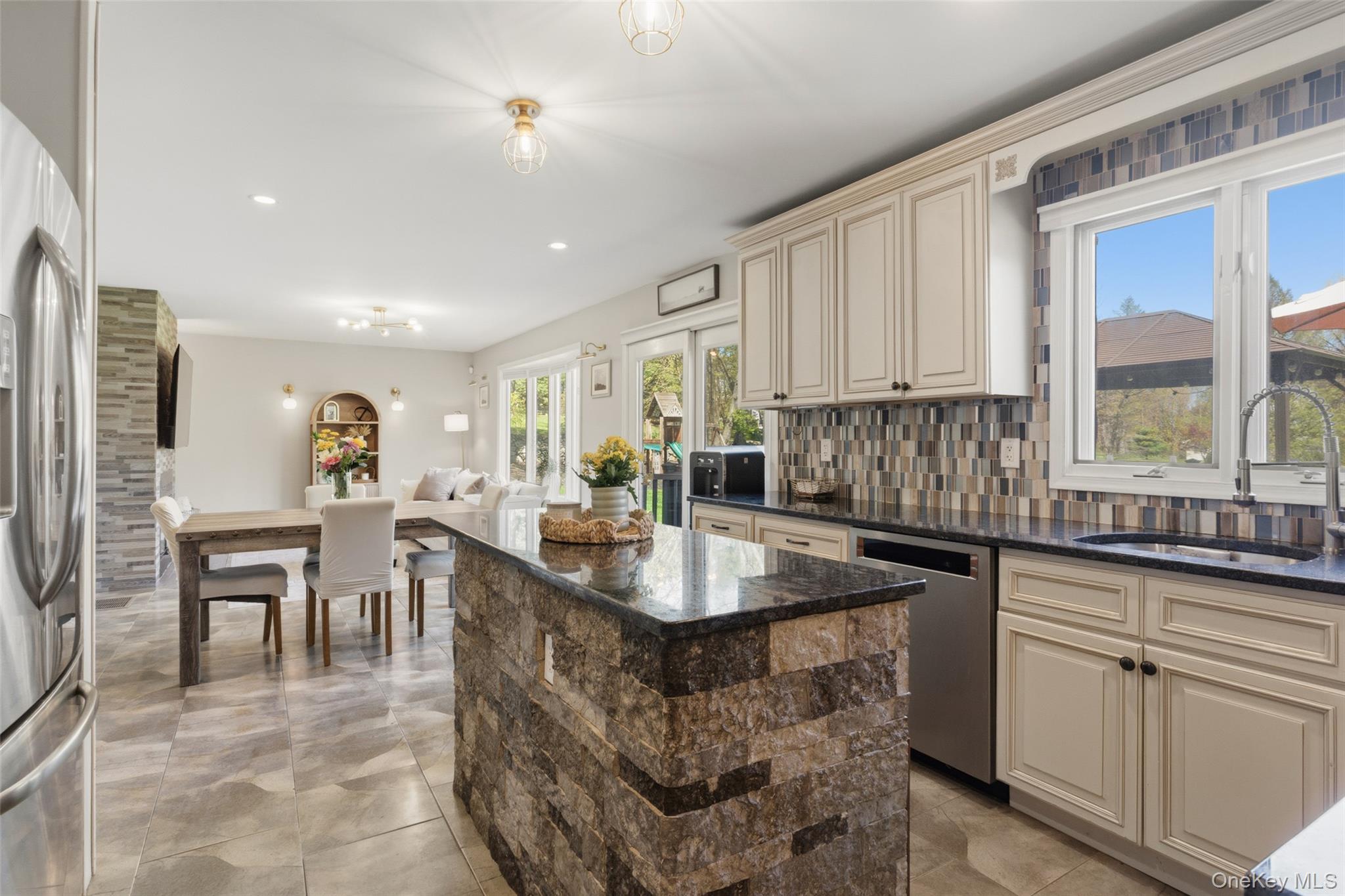 130 Cobb Road Brewster, NY 10509 - Photo 15 of 48 The heart of the home is the well-appointed kitchen, featuring granite countertops, stainless steel appliances, a double wall oven, electric cooktop, and tile flooring