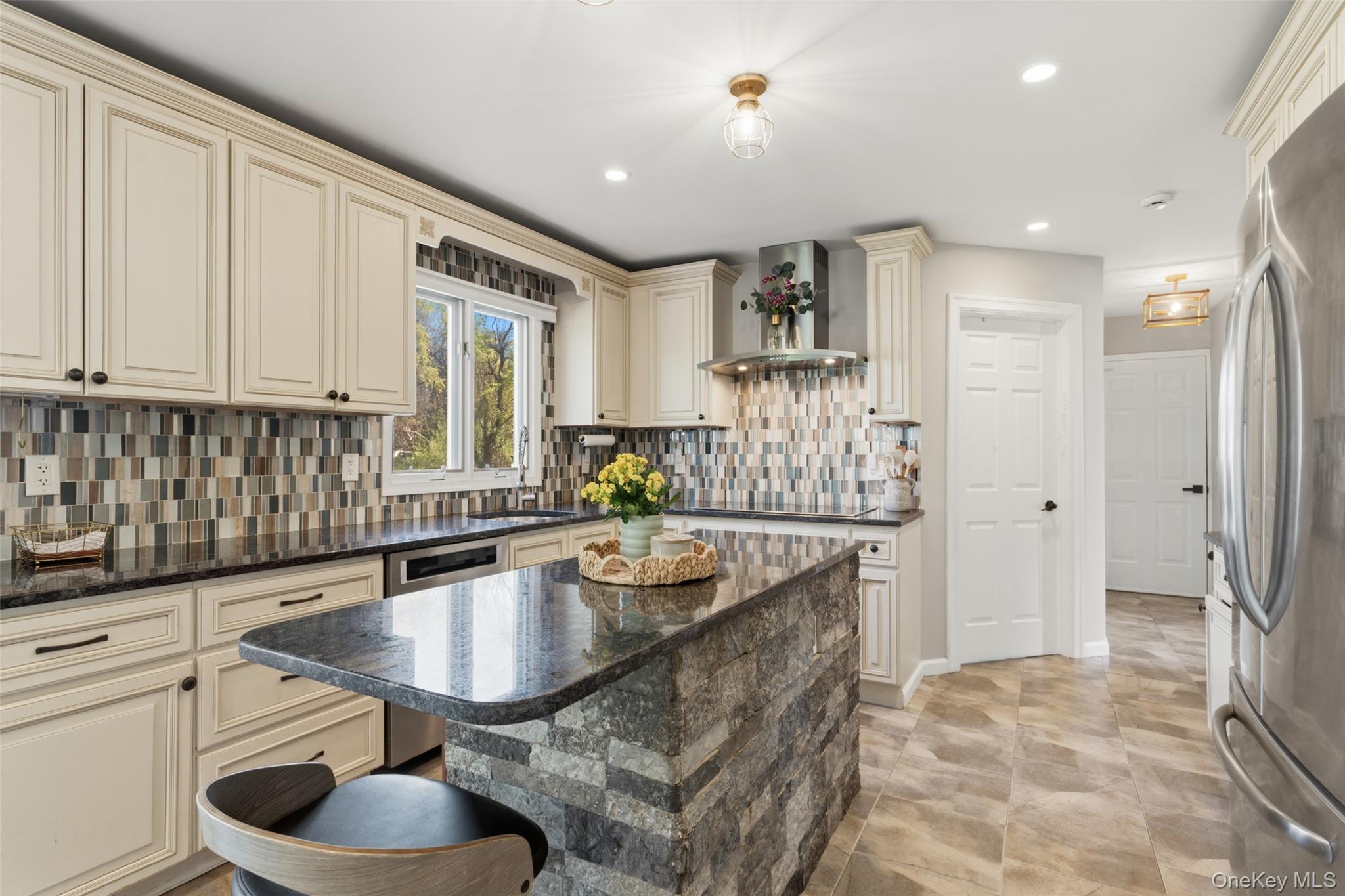 130 Cobb Road Brewster, NY 10509 - Photo 16 of 48 The heart of the home is the well-appointed kitchen, featuring granite countertops, stainless steel appliances, a double wall oven, electric cooktop, and tile flooring