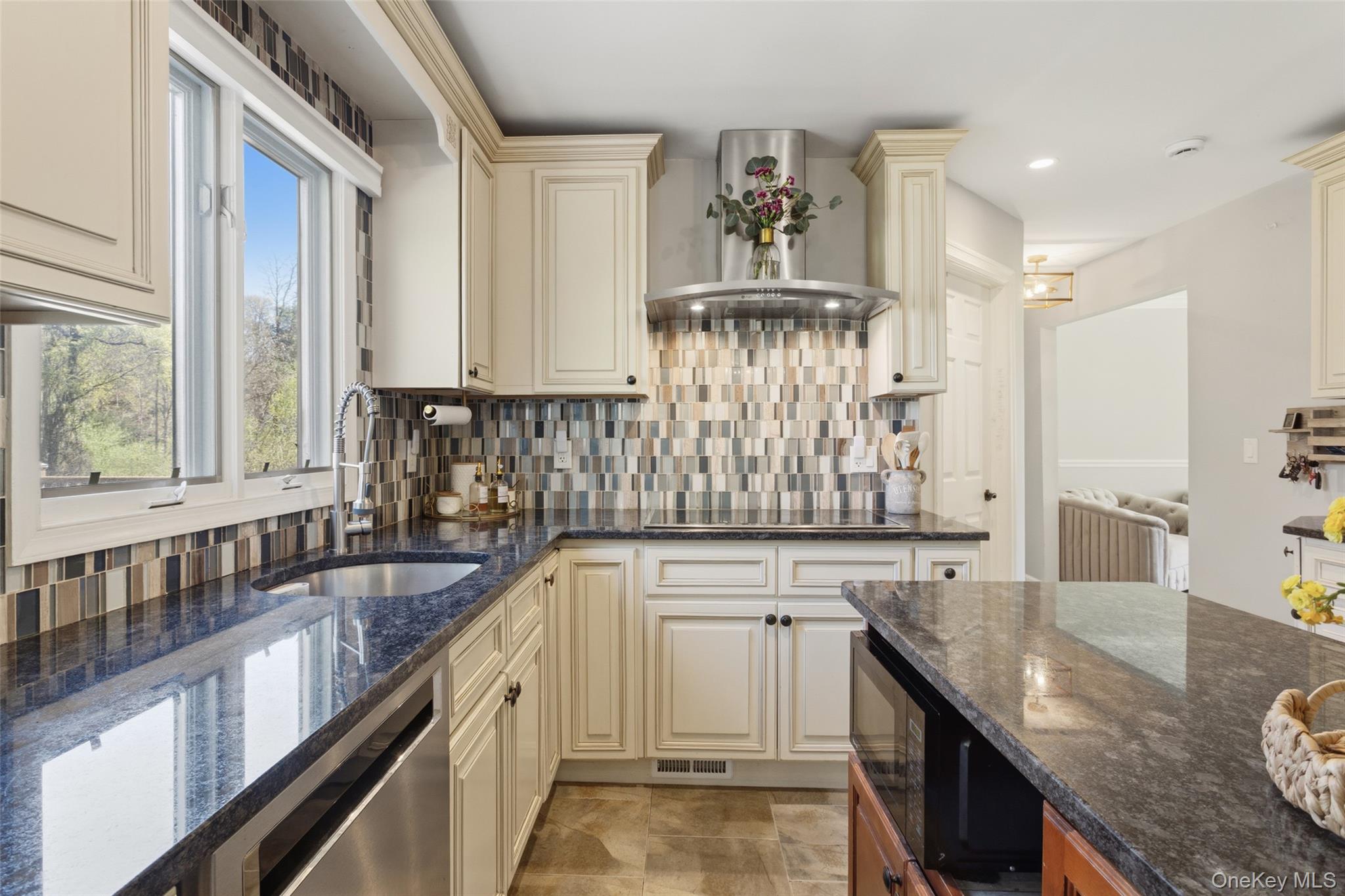 130 Cobb Road Brewster, NY 10509 - Photo 17 of 48 The heart of the home is the well-appointed kitchen, featuring granite countertops, stainless steel appliances, a double wall oven, electric cooktop, and tile flooring
