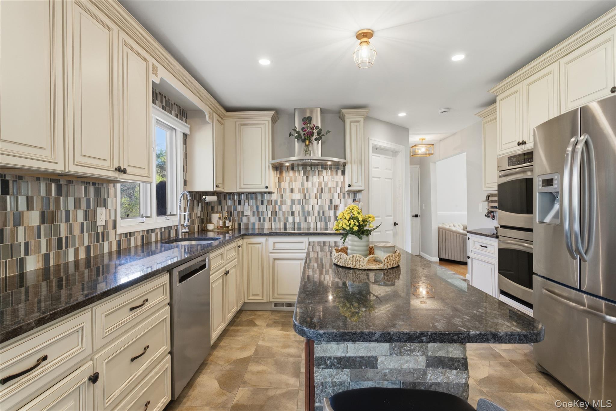 130 Cobb Road Brewster, NY 10509 - Photo 19 of 48 The heart of the home is the well-appointed kitchen, featuring granite countertops, stainless steel appliances, a double wall oven, electric cooktop, and tile flooring