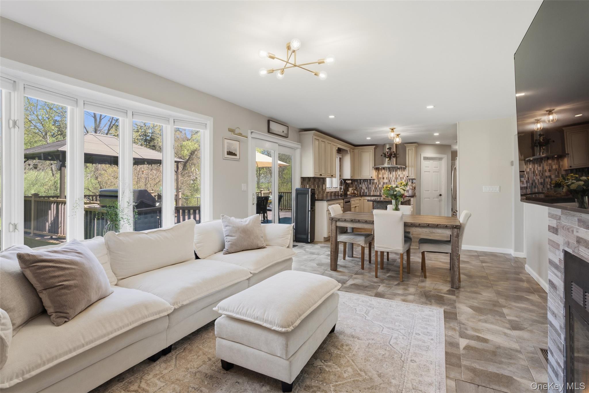 130 Cobb Road Brewster, NY 10509 - Photo 25 of 48 Comfortable family room with a fireplace, creating a seamless flow for modern living