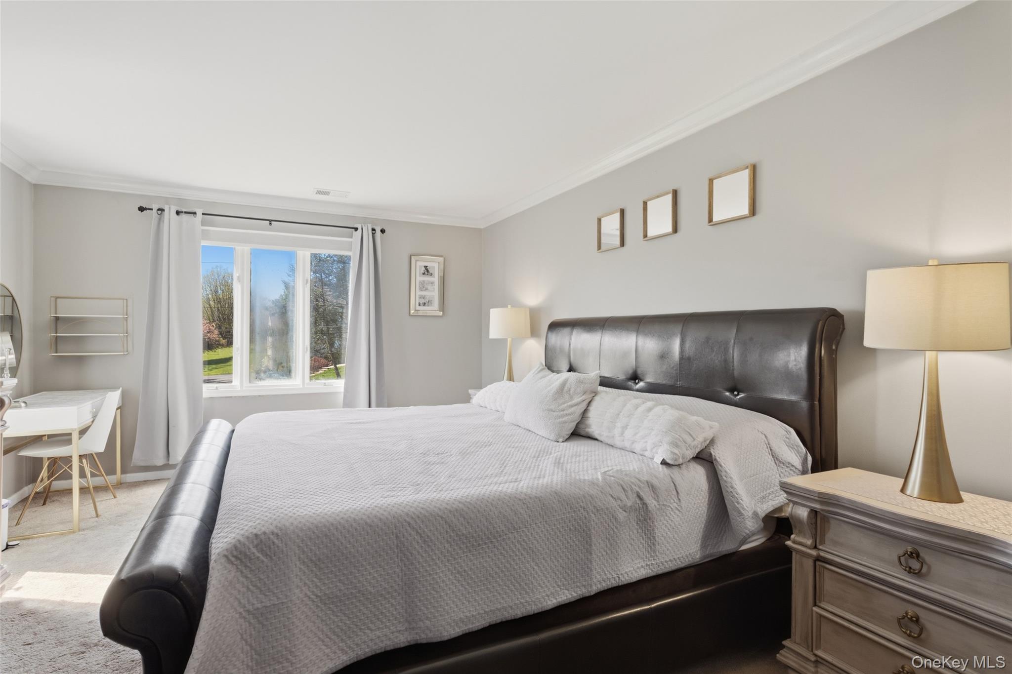 130 Cobb Road Brewster, NY 10509 - Photo 29 of 48 The expansive primary suite offers a walk-in closet, additional linen storage, and a private bath with double vanity and whirlpool tub, along with a separate room that includes both the shower and toilet for added privacy.