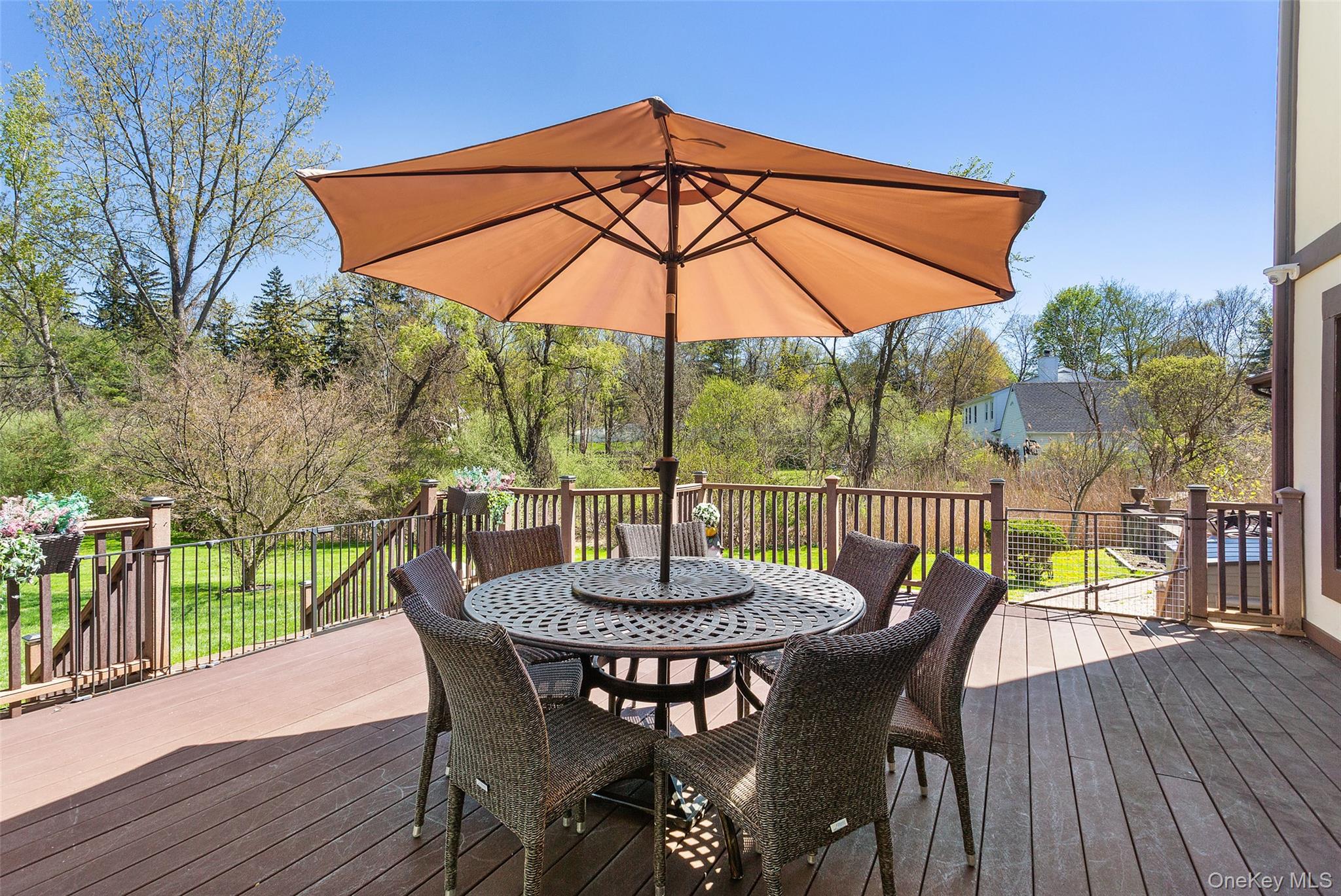 130 Cobb Road Brewster, NY 10509 - Photo 39 of 48 Trex deck overlooking the beautifully level backyard, complete with a pergola for shade—ideal for outdoor dining and relaxing