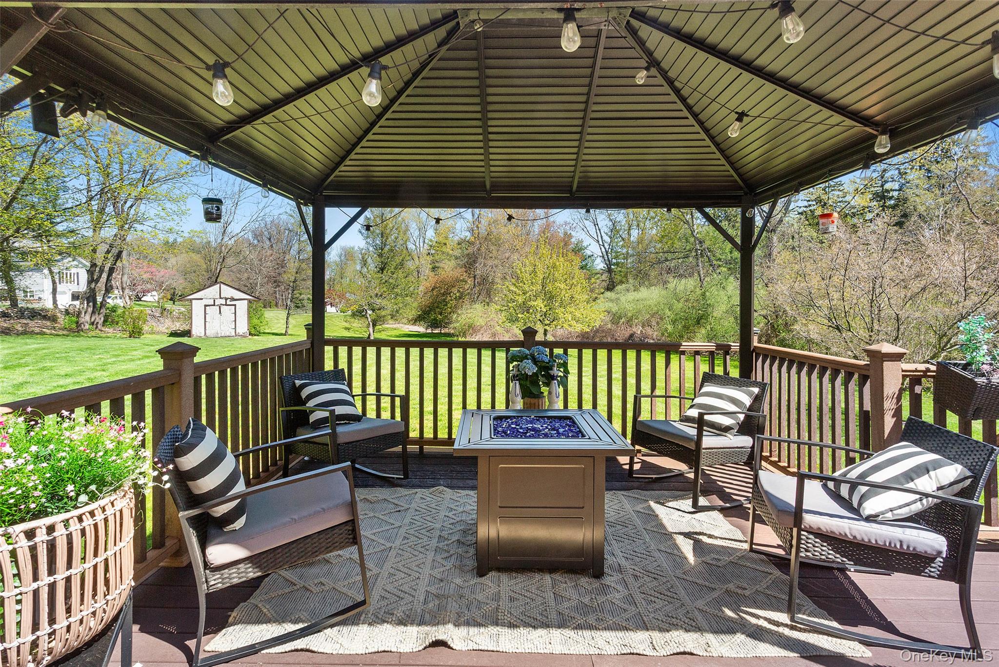 130 Cobb Road Brewster, NY 10509 - Photo 41 of 48 Trex deck overlooking the beautifully level backyard, complete with a pergola for shade—ideal for outdoor dining and relaxing