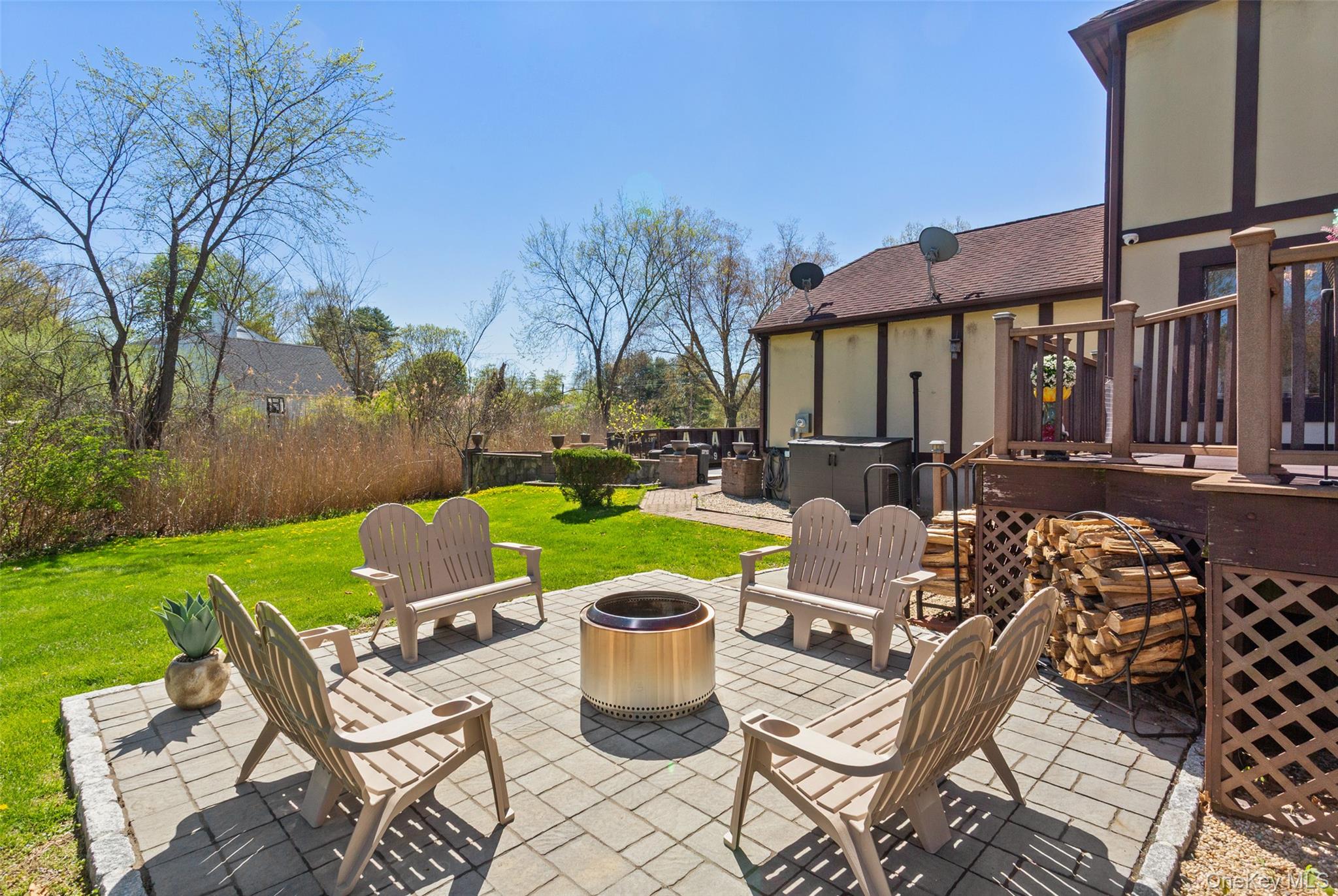 130 Cobb Road Brewster, NY 10509 - Photo 44 of 48 patio with a fire pit area, perfect for entertaining or enjoying quiet evenings.