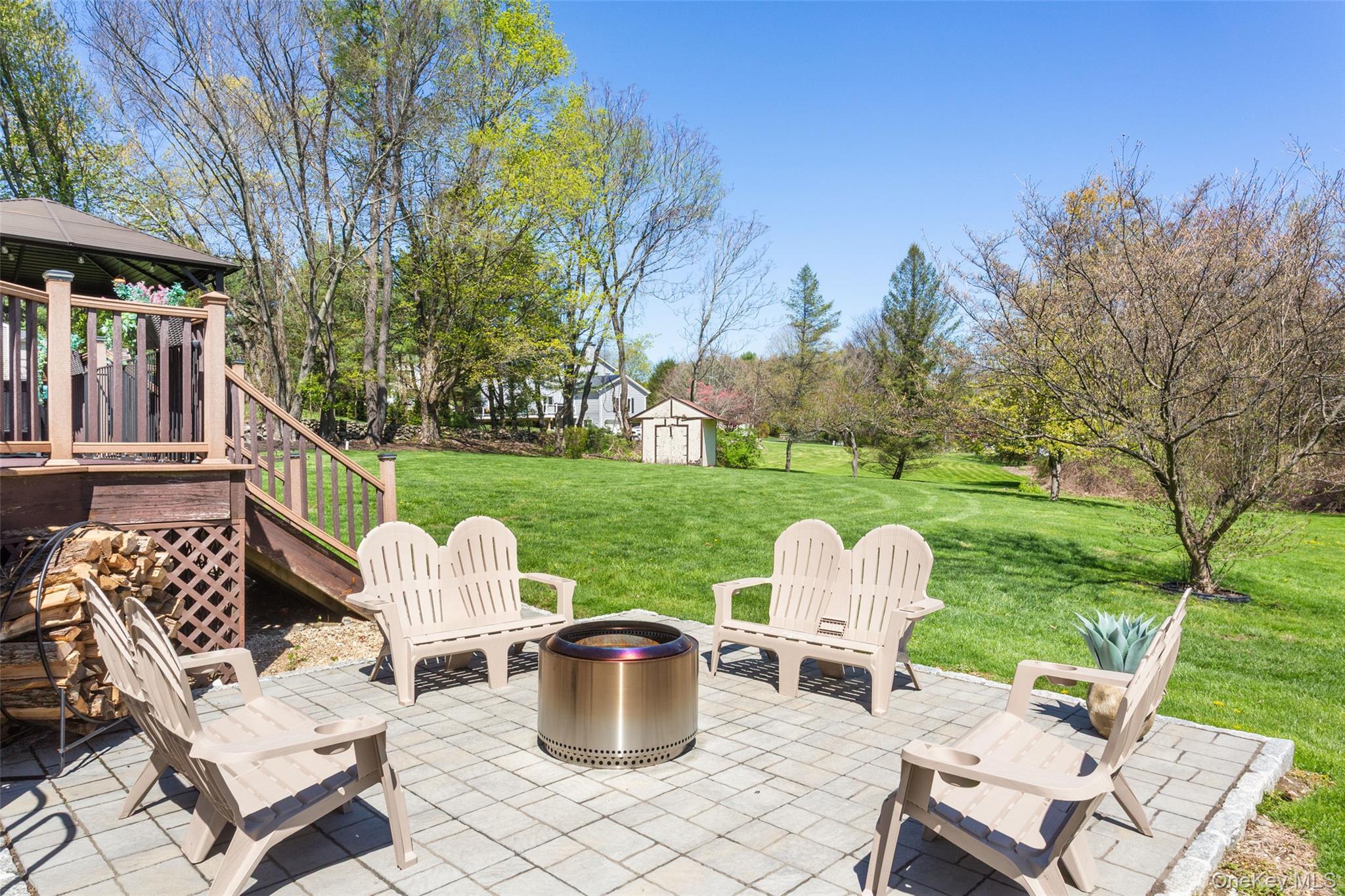 130 Cobb Road Brewster, NY 10509 - Photo 45 of 48 patio with a fire pit area, perfect for entertaining or enjoying quiet evenings.