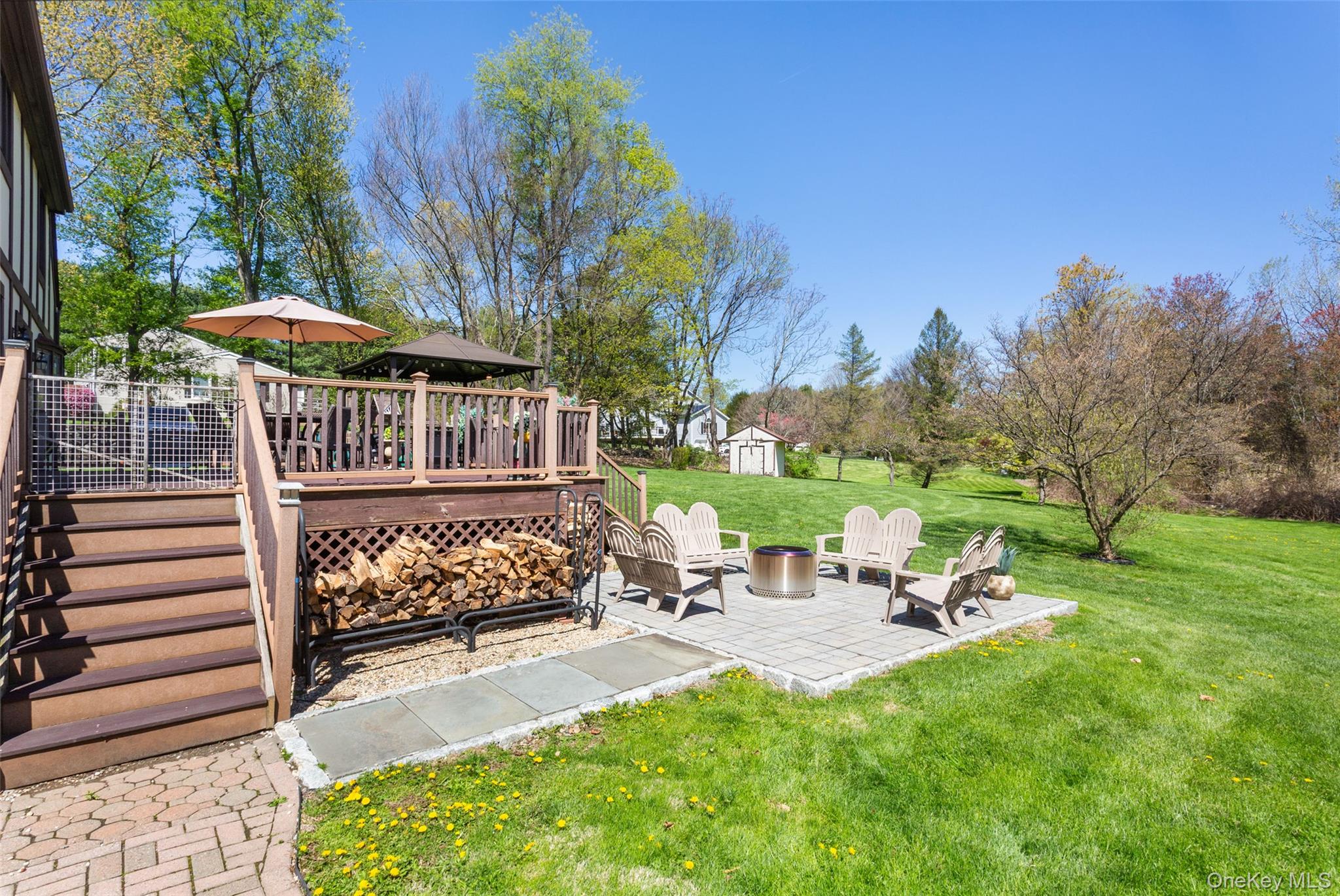130 Cobb Road Brewster, NY 10509 - Photo 46 of 48 patio with a fire pit area, perfect for entertaining or enjoying quiet evenings.