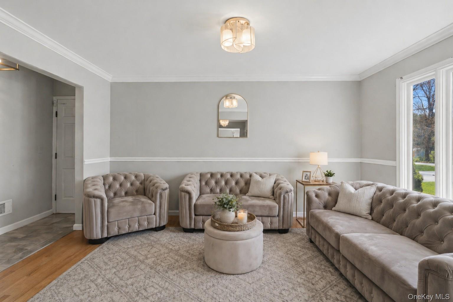 130 Cobb Road Brewster, NY 10509 - Photo 6 of 48 bright formal living room, while the extra-large dining room offers the perfect setting for gatherings, highlighted by a stunning double-sided wood-burning fireplace that adds character and charm