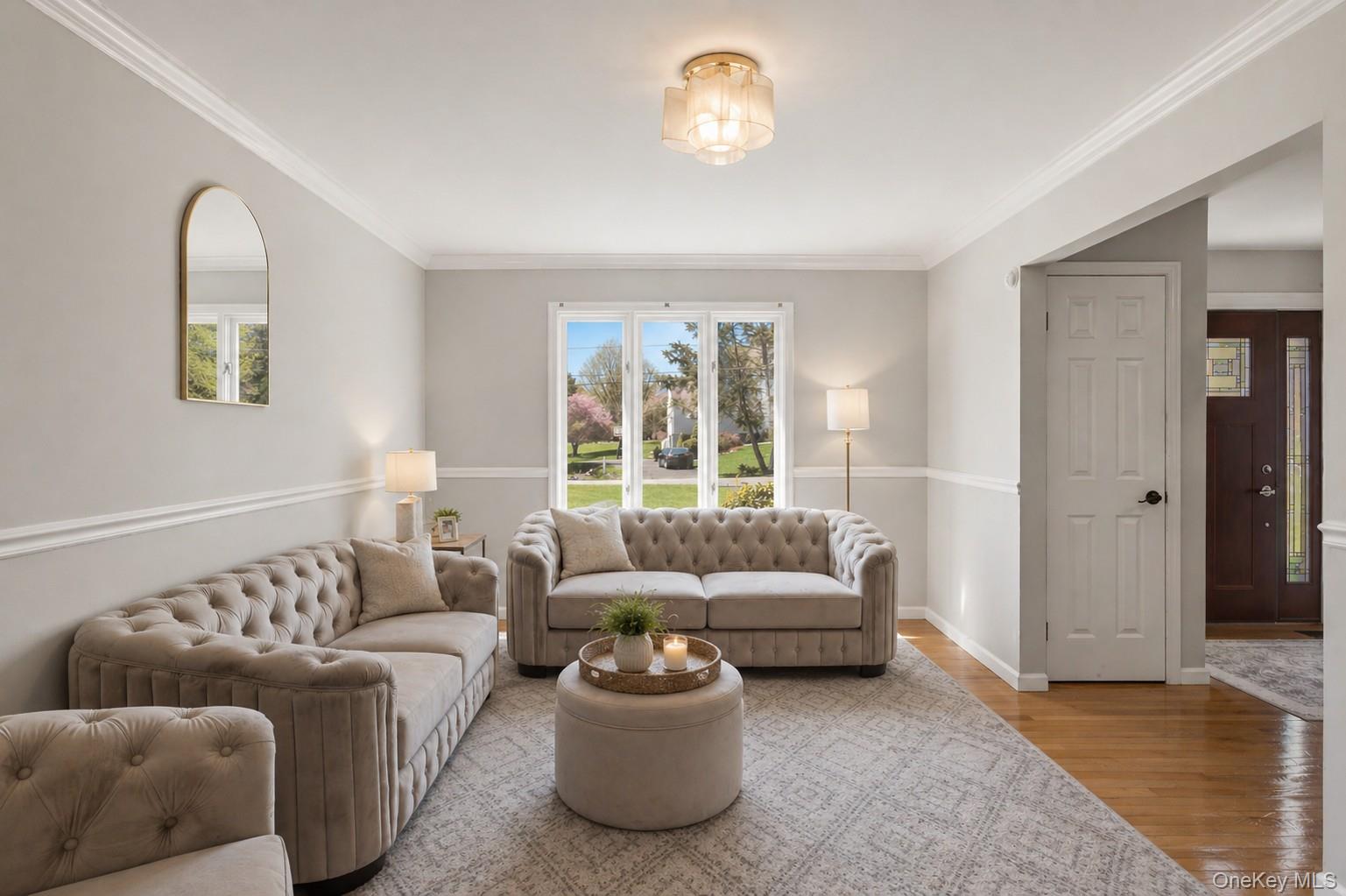 130 Cobb Road Brewster, NY 10509 - Photo 7 of 48 bright formal living room, while the extra-large dining room offers the perfect setting for gatherings, highlighted by a stunning double-sided wood-burning fireplace that adds character and charm