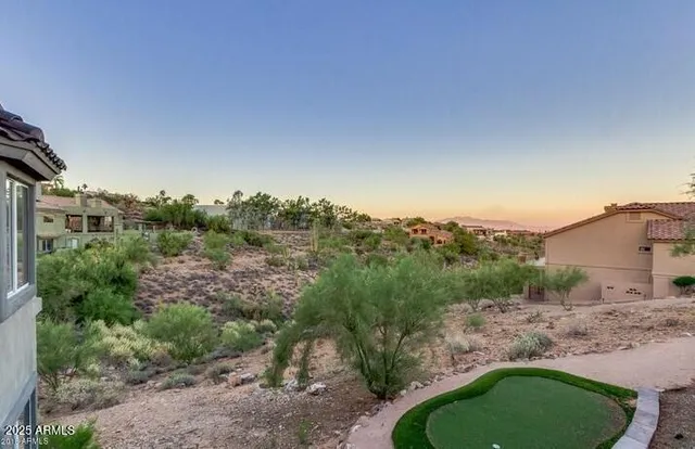 a kitchen with stainless steel appliances kitchen island granite countertop a sink and a refrigerator