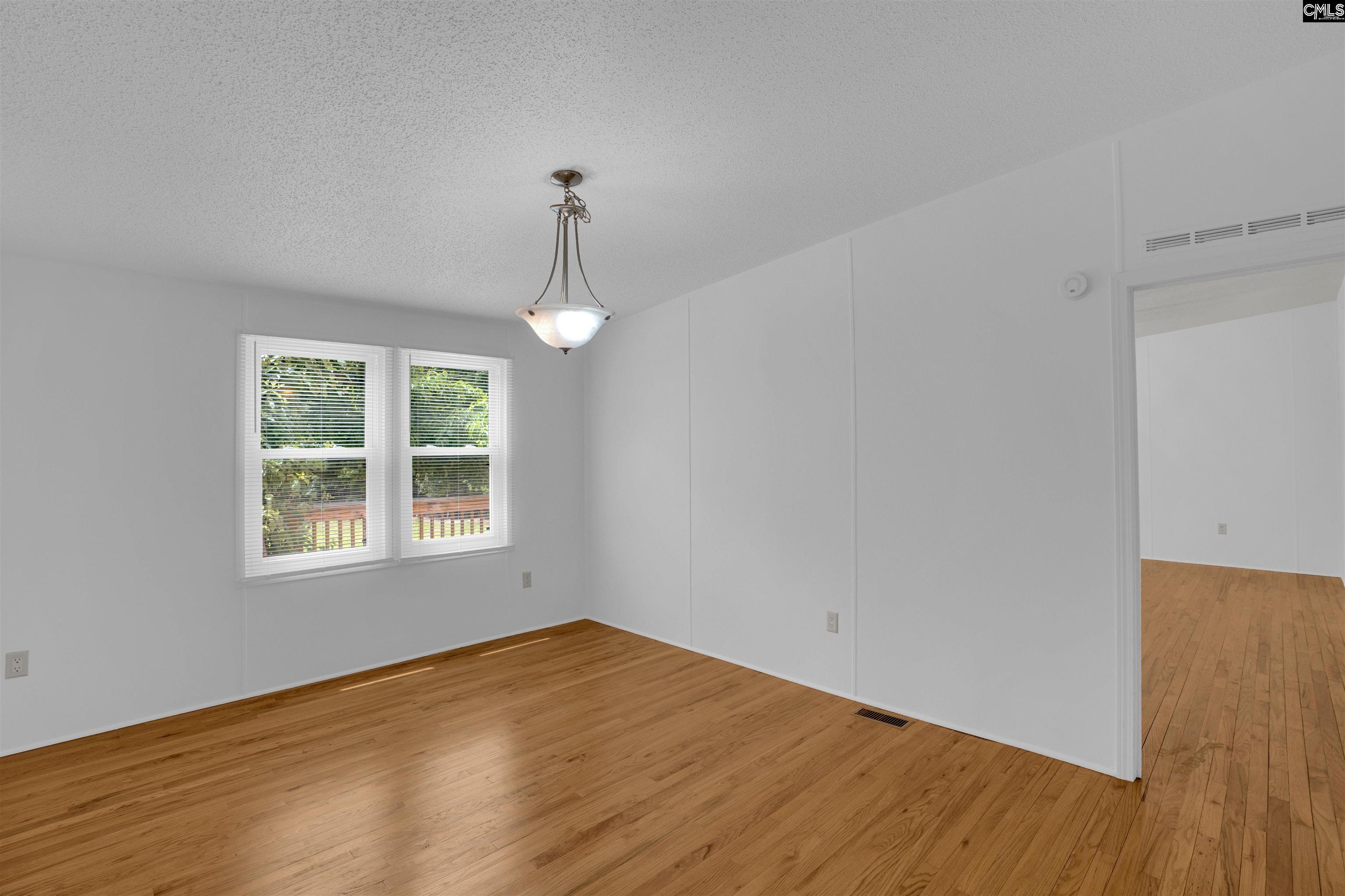 304 Cooper Road Blythewood, SC 29016 - Photo 11 of 29 a view of empty room with wooden floor and fan