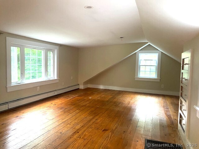 623 Elm Street Monroe, CT 06468 - Photo 18 of 22 an empty room with wooden floor and windows