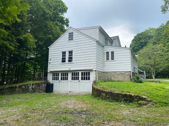 623 Elm Street Monroe, CT 06468 - Photo 22 of 22 a view of a house with a yard and a garden