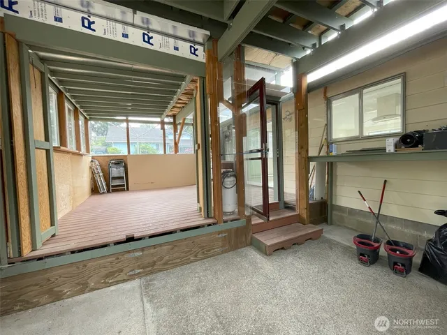 a view of an empty room with a balcony