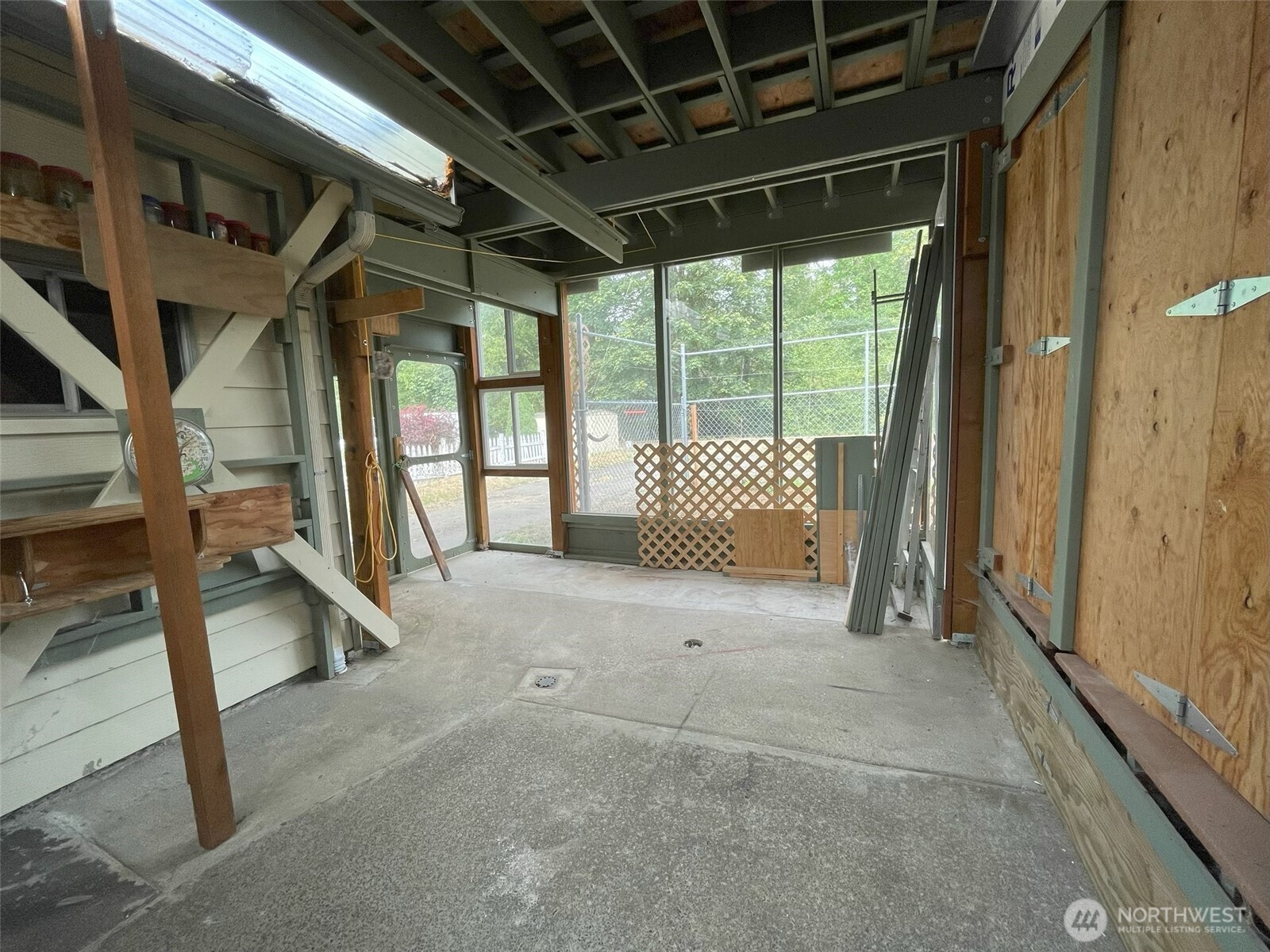 200 Madison Street Ryderwood, WA 98581 - Photo 12 of 26 a view of an empty room with a balcony