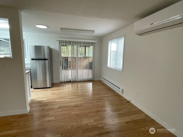 200 Madison Street Ryderwood, WA 98581 - Photo 3 of 26 a view of empty room with wooden floor and fan