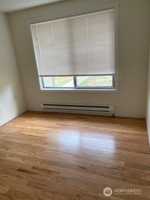 200 Madison Street Ryderwood, WA 98581 - Photo 7 of 26 a view of a room with wooden floor and a window