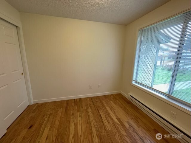200 Madison Street Ryderwood, WA 98581 - Photo 8 of 26 a view of a small space with wooden floor and a window