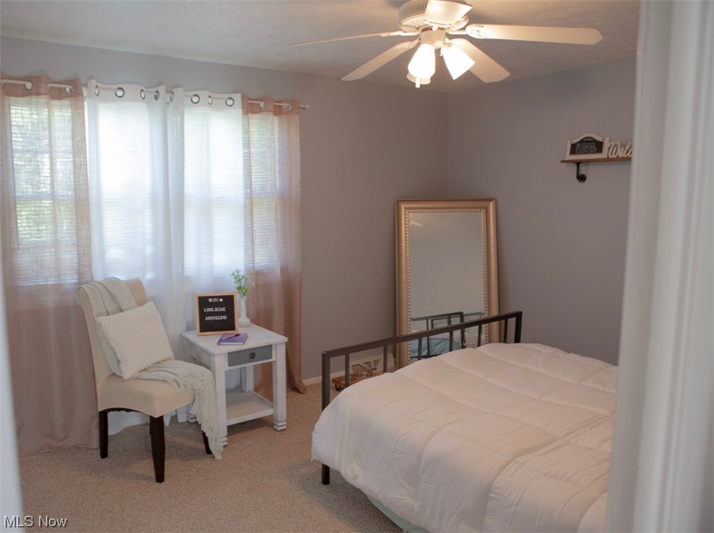 519 Button Road Bedford, OH 44146 - Photo 18 of 26 Carpeted bedroom featuring ceiling fan