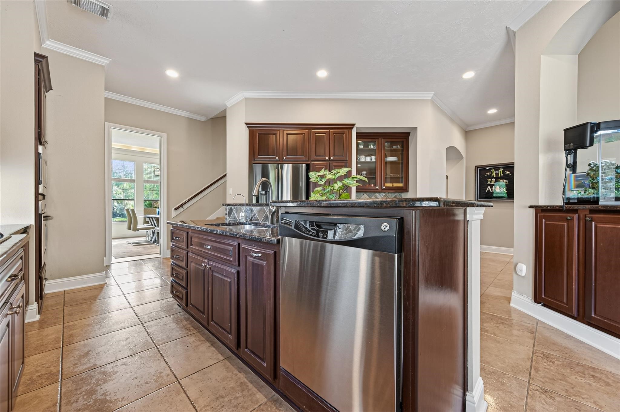 2007 Cliff Manor Drive Conroe, TX 77304 - Photo 11 of 35 a kitchen with stainless steel appliances granite countertop a refrigerator and a stove top oven