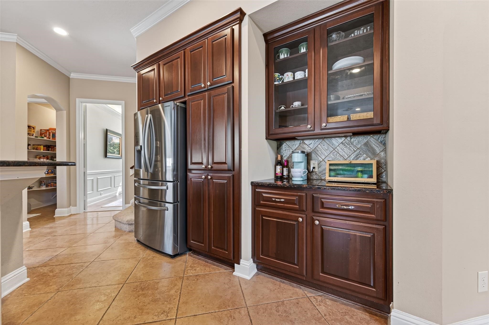 2007 Cliff Manor Drive Conroe, TX 77304 - Photo 13 of 35 a kitchen with granite countertop a refrigerator and a stove top oven