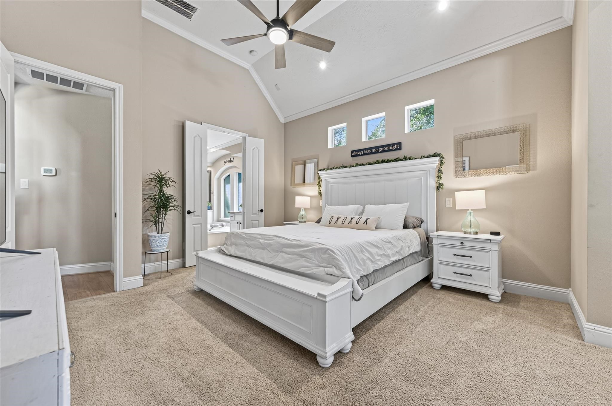 2007 Cliff Manor Drive Conroe, TX 77304 - Photo 16 of 35 a bedroom with a bed and a chandelier