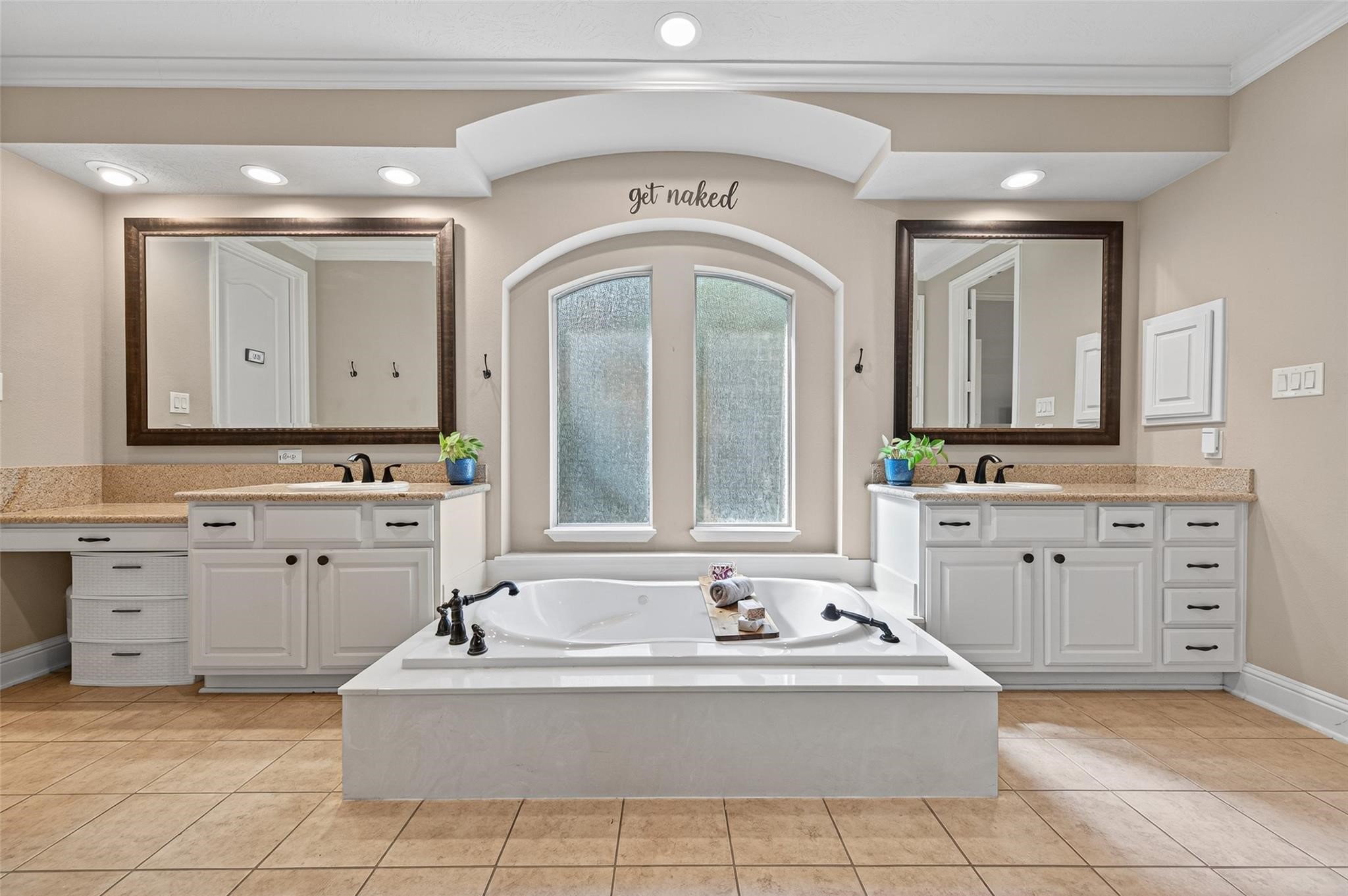 2007 Cliff Manor Drive Conroe, TX 77304 - Photo 17 of 35 a large white bathroom with a sink a large mirror and a bathtub