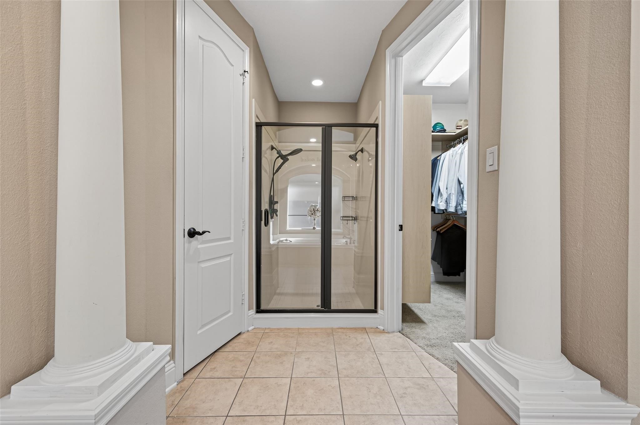 2007 Cliff Manor Drive Conroe, TX 77304 - Photo 19 of 35 a view of a hallway with wooden floor and a bathroom