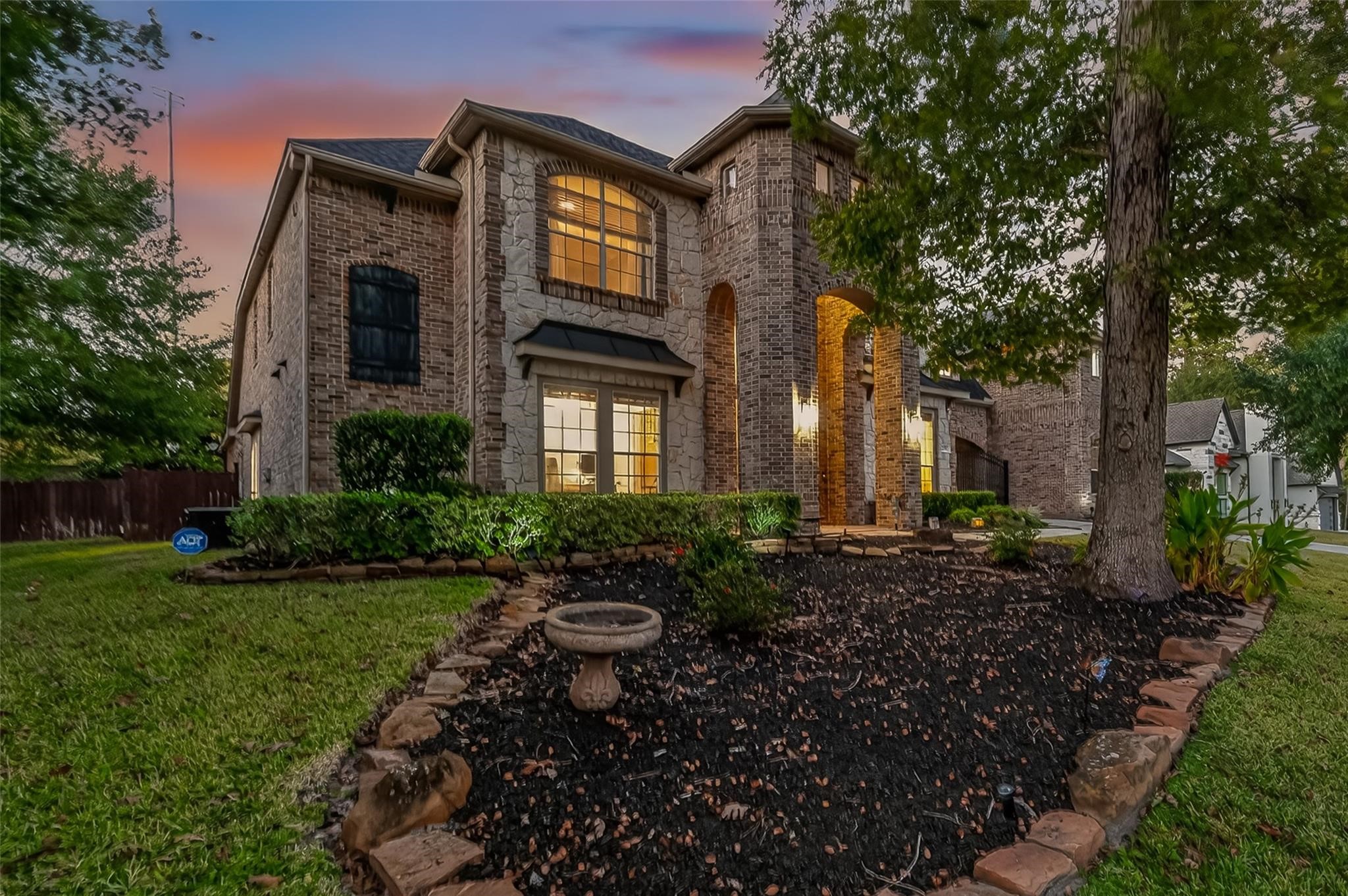 2007 Cliff Manor Drive Conroe, TX 77304 - Photo 2 of 35 a view of a brick house with a yard and plants