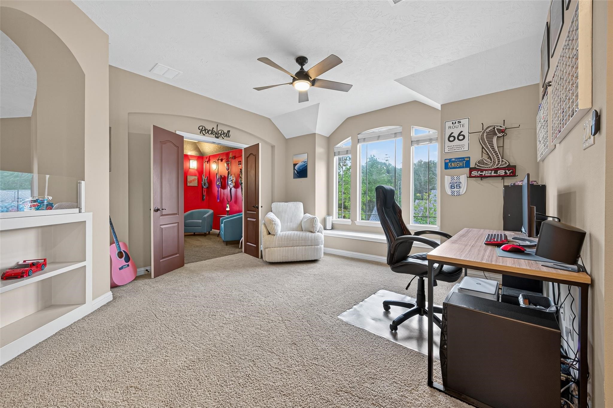 2007 Cliff Manor Drive Conroe, TX 77304 - Photo 22 of 35 a living room with furniture a flat screen tv and a chandelier