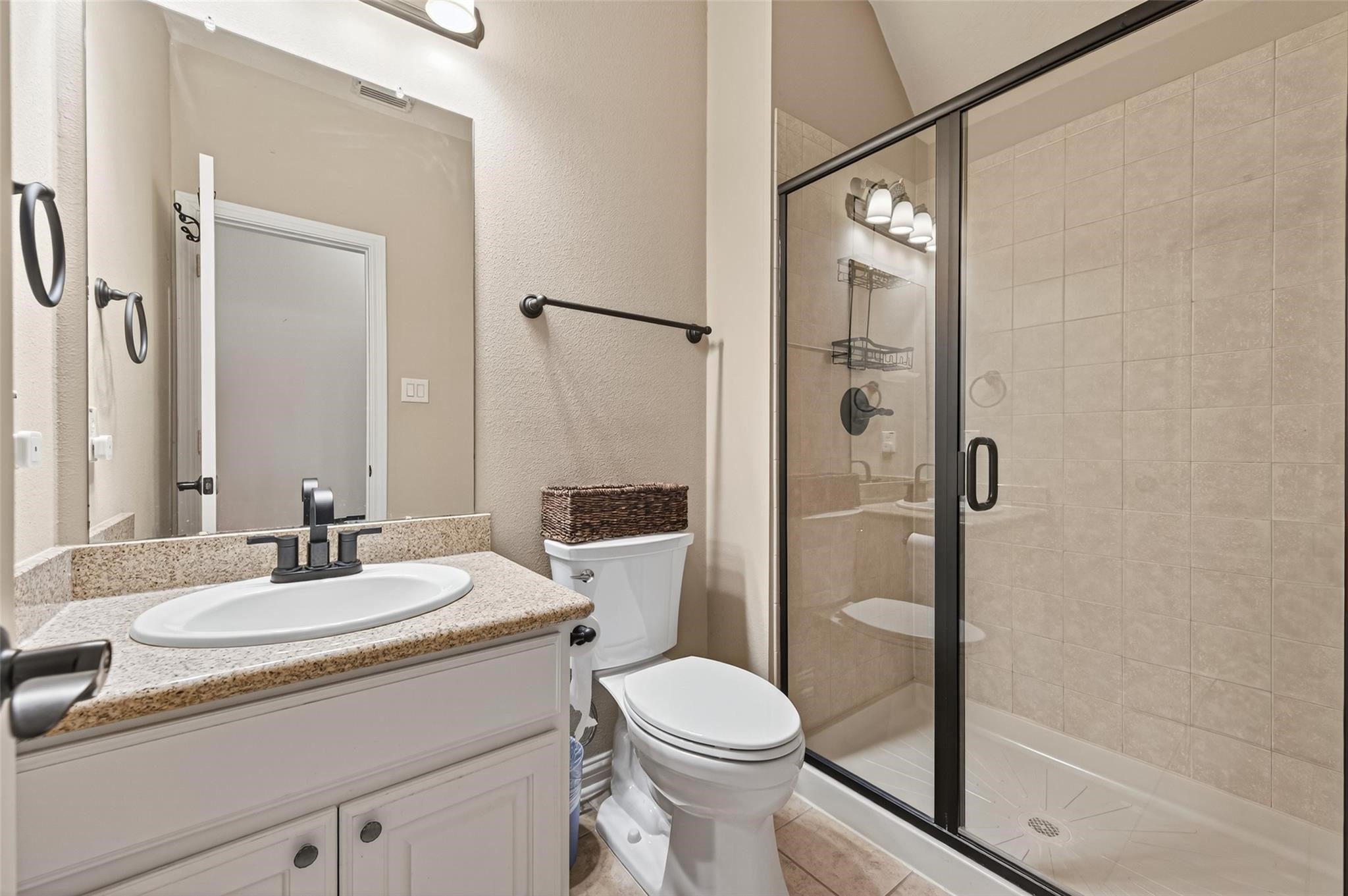 2007 Cliff Manor Drive Conroe, TX 77304 - Photo 27 of 35 a bathroom with a sink toilet and shower