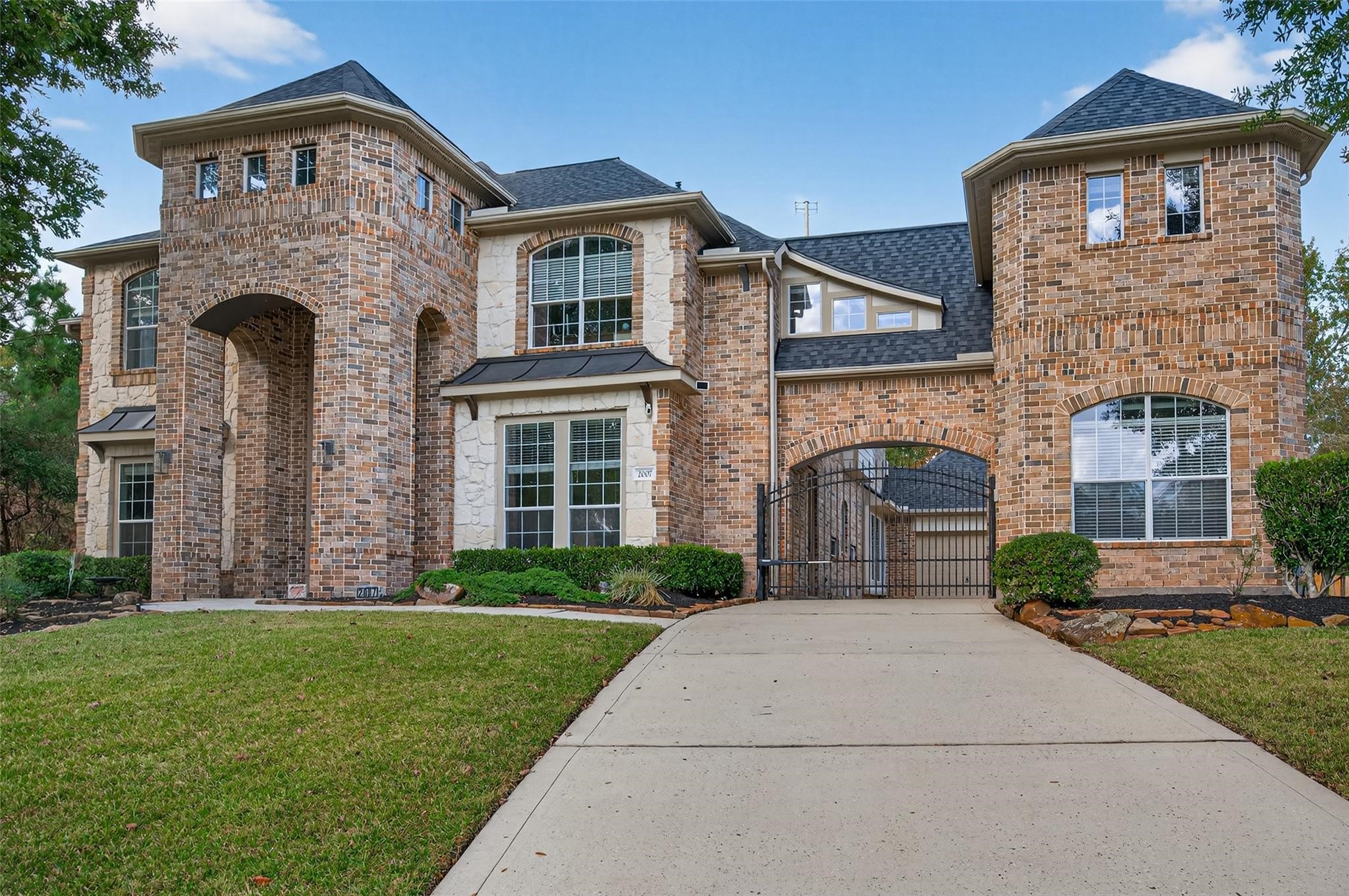 2007 Cliff Manor Drive Conroe, TX 77304 - Photo 30 of 35 a front view of a house with garden