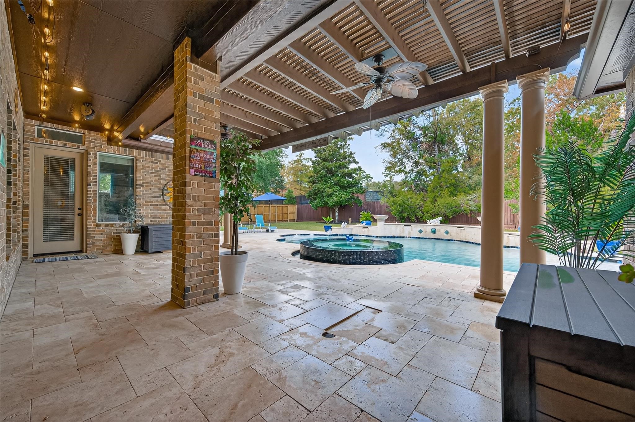 2007 Cliff Manor Drive Conroe, TX 77304 - Photo 31 of 35 a view of a patio with chairs and a backyard
