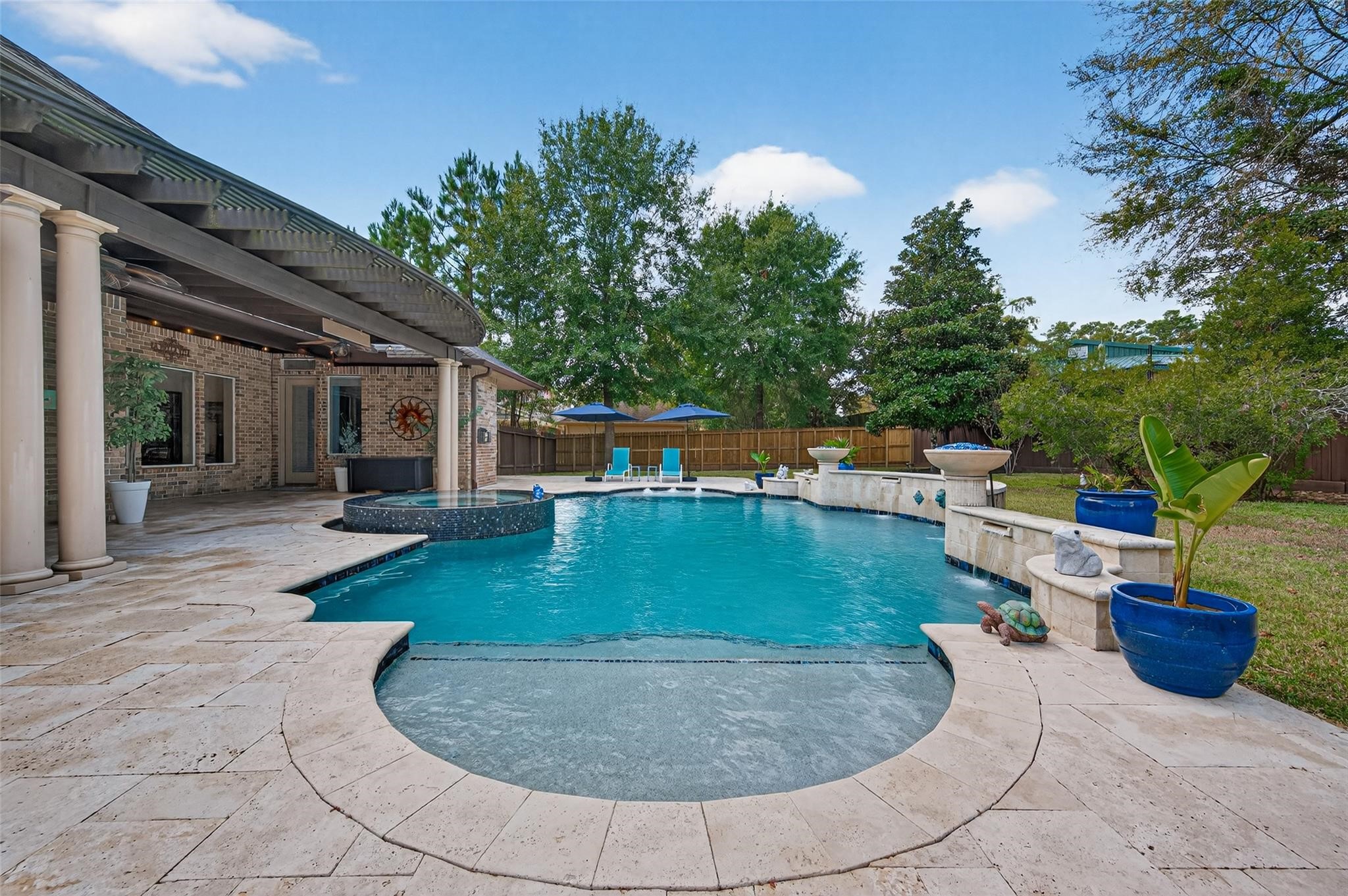 2007 Cliff Manor Drive Conroe, TX 77304 - Photo 34 of 35 a view of a swimming pool with a patio