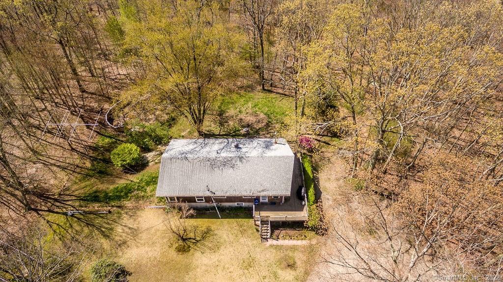224 Spaulding Road Plainfield, CT 06374 - Photo 1 of 1 a view of a yard with chairs and bench