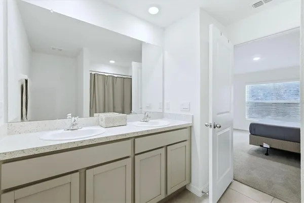 a view of an empty room and a window