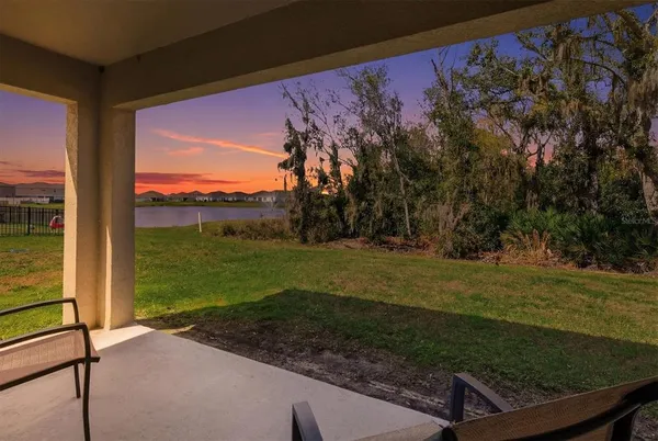 a view of a lake with houses in the back