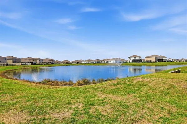 a view of a lake with a yard