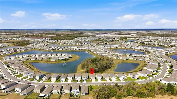 an aerial view of a house with a ocean view